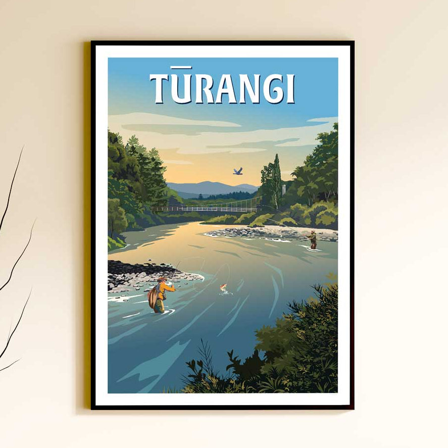 A framed travel-style poster of Türangi hanging on a beige wall above a light wood console table with decorative vases, books, and a metallic object.